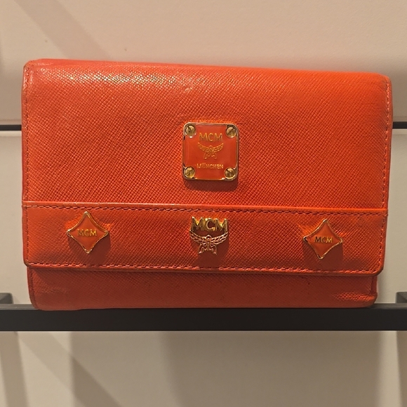 MCM Handbags - MCM Orange Saffiano Leather Flap Wallet with Gold Accents